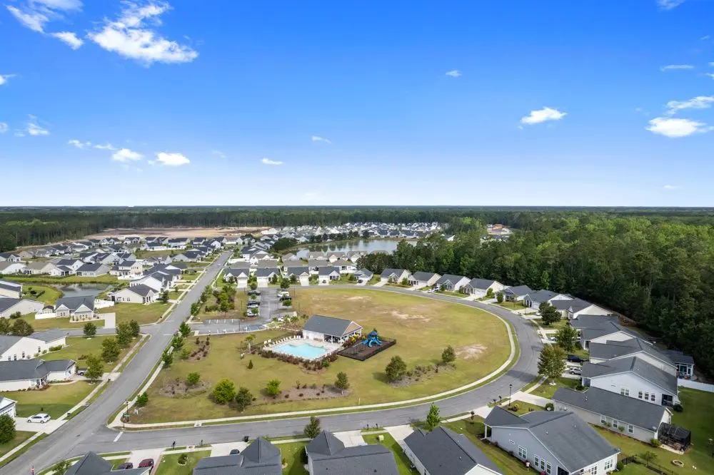 Aerial view of a waterfront home and lawn