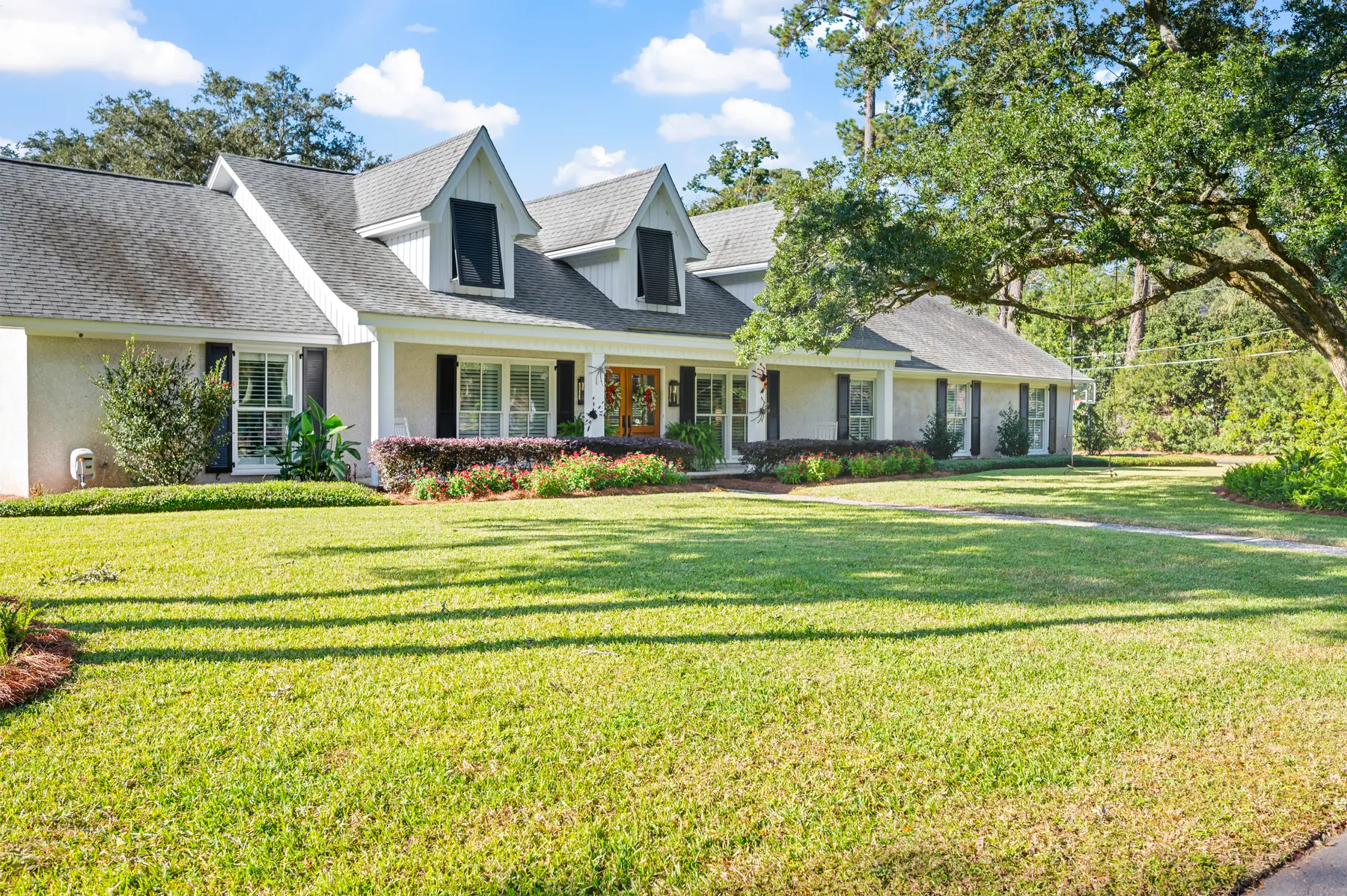 Aerial view of a home with a pool and screened porch