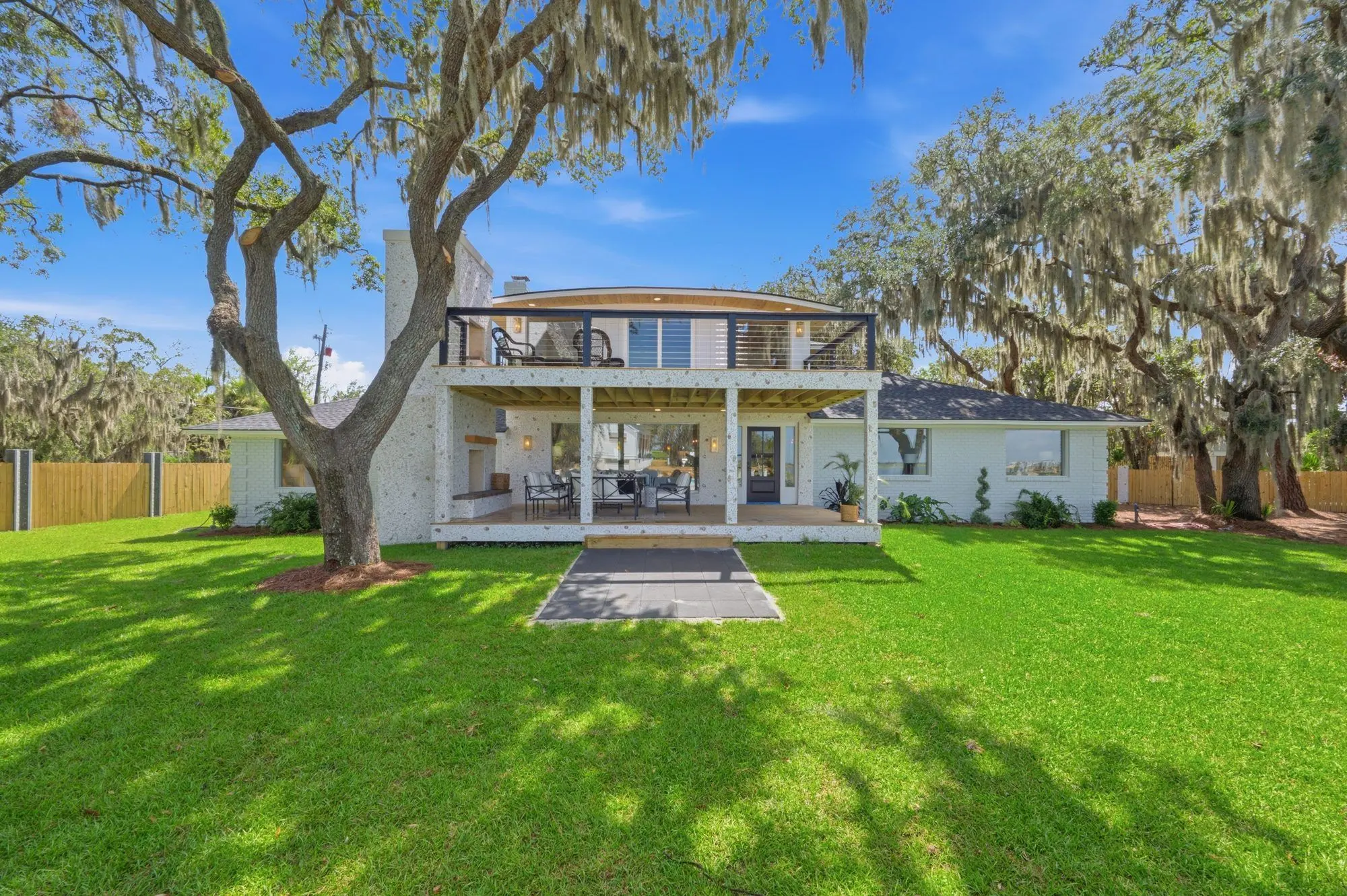 Backyard lawn under live oaks with Spanish moss in Savannah, GA